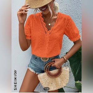 Bright orange embroidered top